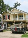 Crews complete the final finish on two Brazos models side by side for two families in Chalmette, Louisiana.