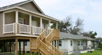 This Columbus is elevated on stilts in a neighborhood in Arabi, LA. It features 1,525 sq. ft., 3 bedrooms and 2 baths. Terry Tedesco is the local builder.
